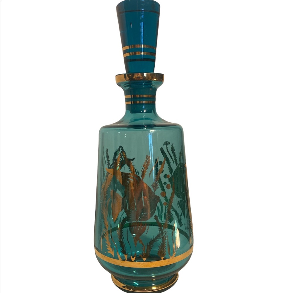 Cobalt blue decanter with fish design.